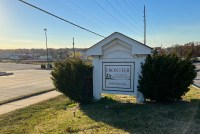 A sign shows the name of Frontier Health & Rehabilitation, a nursing home in St. Charles, Missouri.