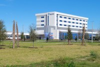 A photo of a hospital building with a sign that reads, "BayCare."