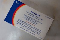 A box of Paxlovid is photographed from above.